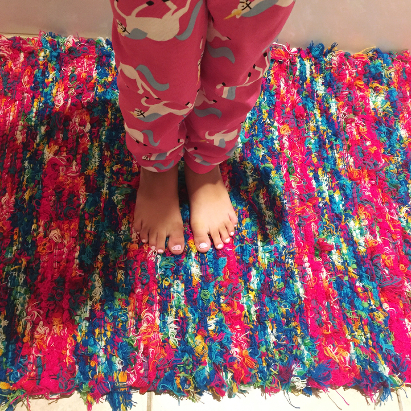“This little one is genuinely grateful for Kathy’s rug, a comfortable, warm place for these small feet. At a young age, the kid already has an appreciation for the fine craft of a local artisan.” -Dawn B.